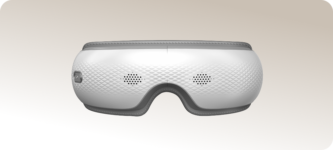 Masażer oczu SKG ES300 w kolorze biało-szarym, z teksturą przypominającą romby na obudowie