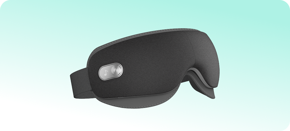 Masażer oczu SKG ES500 w kolorze szarym, z przyciskiem do sterowania muzyką i regulowanym paskiem