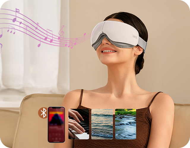 Kobieta relaksuje się przy muzyce, używając białego masażera oczu SKG ES500 z funkcją Bluetooth