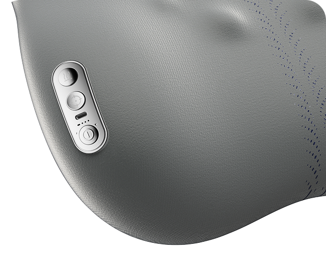 Zbliżenie na szary masażer pleców SKG TS700, ukazujące panel sterowania z przyciskami i wskaźnikiem baterii