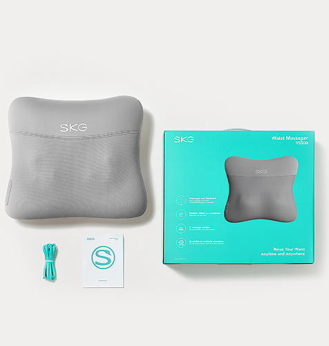 Masażer pleców SKG VS500, jego opakowanie, turkusowy kabel i broszura z logo S, widok z góry