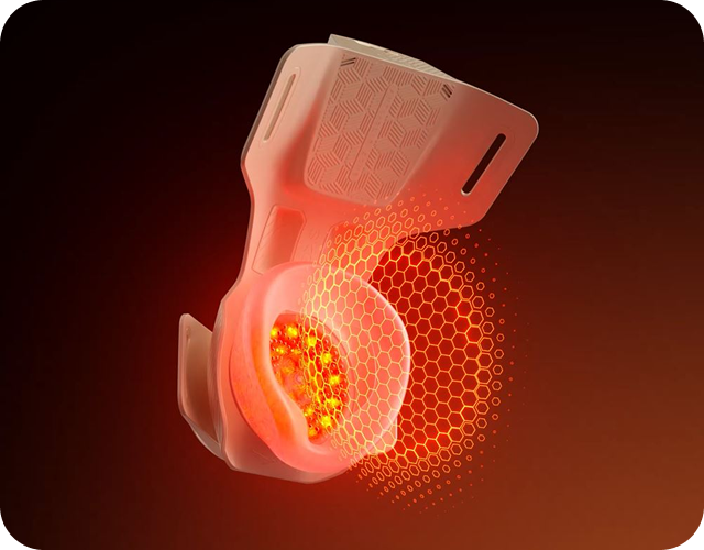 Schemat masażera kolan SKG. Wewnątrz widoczna jest czerwona siatka i intensywne, żółto-czerwone światło.